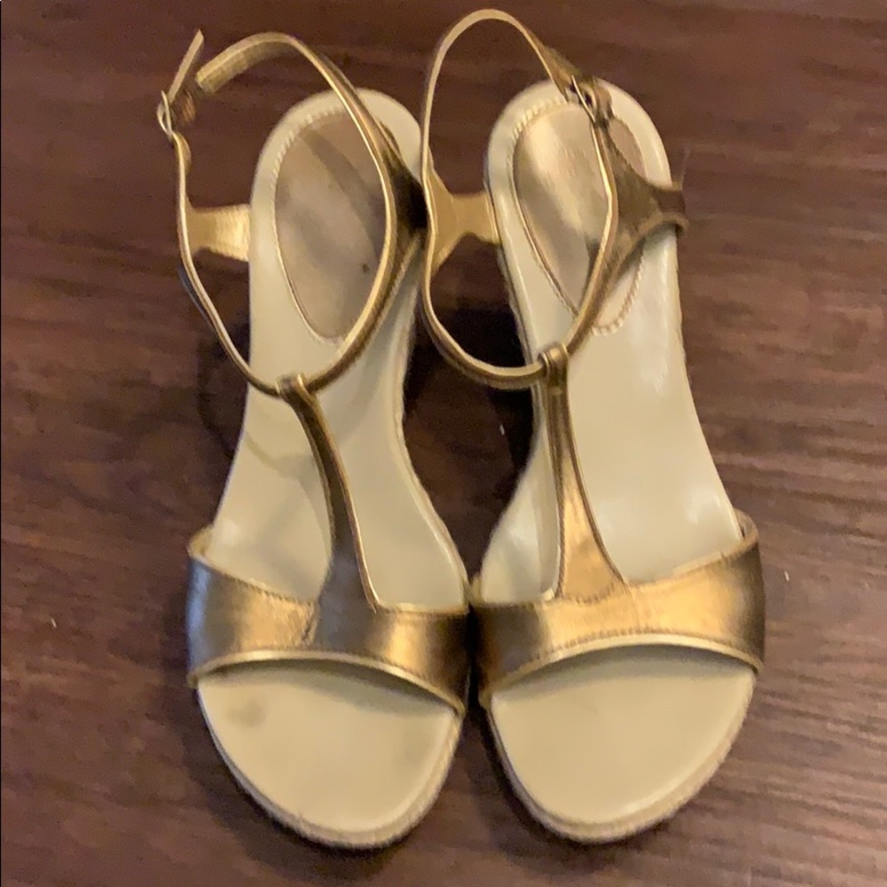 4 inch wedge heel. Worn but in good condition.